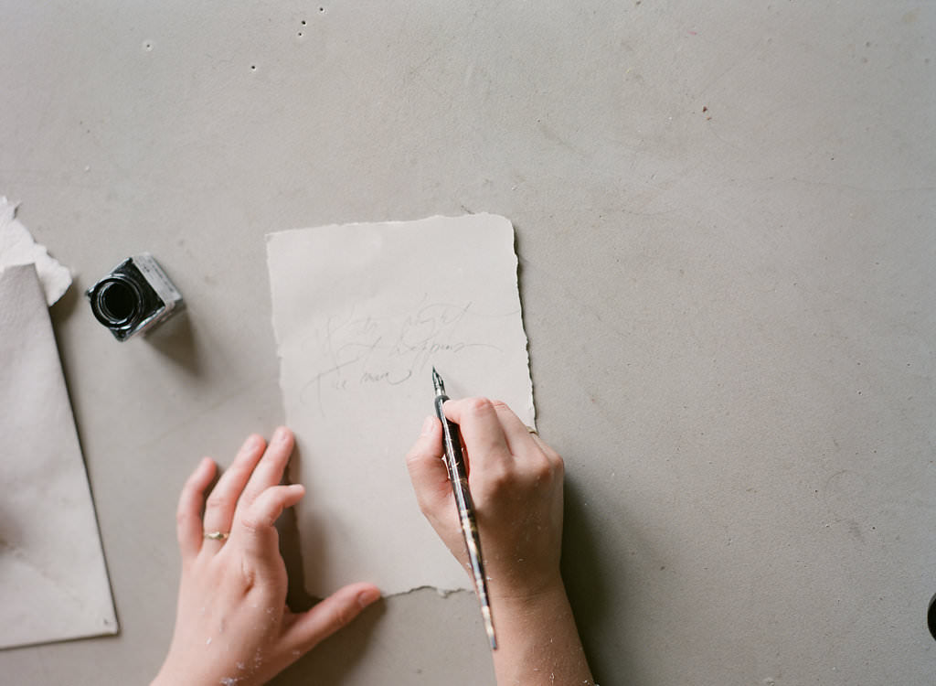 Unveiling the secret of writing on handmade paper, each stroke of the nib echoes with a timeless elegance. Discover the charm of calligraphy today.